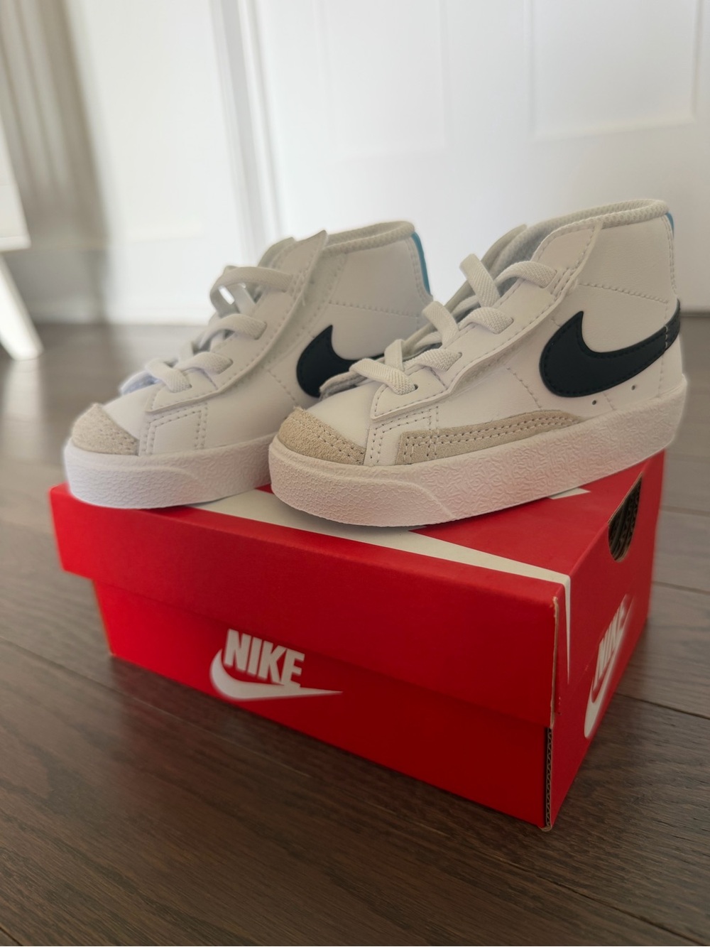 Nike Kids White High-Top Sneakers with Black Swoosh and Beige Accents